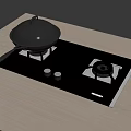 Black Gas Stove Top with Pot Lid and Small Cups on Wooden Countertop
