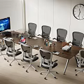 Modern Office Wooden Conference Table With Grey Wheeled Chairs Computer Monitor And Wall Clock