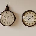 Two Different Style Wall Clocks Hanging On White Wall With Classic And Modern Design