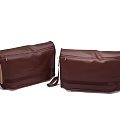 Two Stylish Brown Leather Messenger Bags With Sleek Design And Zipper Closure