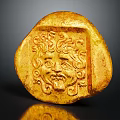 Ancient Gold Carved Artifact With Intricate Face Relief And Decorative Patterns 3d model