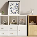 White and Light Wood Bookcase with Books Camera Clock Radio Decorative Items and Wall Art
