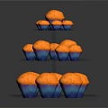 Three Tiered Transparent Glass Cupcake Stand Holding Multiple Orange Cupcakes