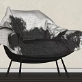 Modern Accent Chair Covered With Black White Ombre Throw Blanket And Sleek Black Metal Legs