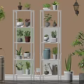 White Multi Tiered Shelving Unit With Various Potted Plants For Indoor Decoration