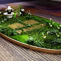 Giant Panda Themed Decorative Landscape Featuring Green Plants Small Panda Figurines And Golden Letters