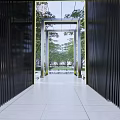 Modern Residential Landscape Entrance with Metal Grille Pathway Framing Green Plants and Sky