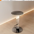 Contemporary Round Accent Table with Polished Metal Frame and Clear Glass Top in Stylish Interior