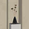Black Cone Shaped Textured Vase With Dried Brown Flowers On Light Stand Against Beige Wall