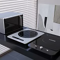 Sleek Modern Kitchen Countertop With Microwave Oven And Induction Cooktops Appliances