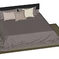 Modern Double Bed with Black Headboard Gray Bedspread and Decorative Pillows on Woven Rug
