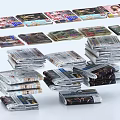 Stacked Newspapers And Magazines With Various Colorful Covers Arranged On