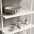 Modern White Wall Shelving Unit With Neatly Arranged Decorative Plates Bottles And Vases