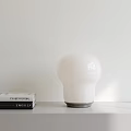 Minimalist Modern White Spherical Table Lamp on White Table with Books 3d model