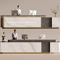 Modern Front Desk Reception with Marble Countertop Two Computer Monitors Staff Standing and Decorative Plant