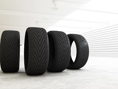 Four Black High Performance Tires With Tread Pattern In Modern Studio 3d model