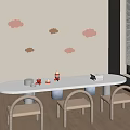 Wooden Kids Chairs In Children's Play Area With White Oval Table Cloud Wall Decorations And Toys