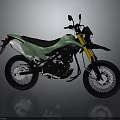 Green Adventure Motorcycle With Black Seat Yellow Forks And Spoked Wheels