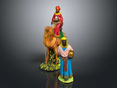 Painted Camel Figurine on Grassy Base with Person Riding and Standing Figure Holding Water Jug 3d model