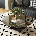 Black Base Round Glass Coffee Table with Vase White Flowers Magazine on Geometric Rug