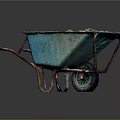 Blue Garden Wheelbarrow Filled With Dark Soil And Rusty Metal Handles