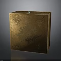 Golden Decorative Box With Intricate Floral Patterns And Green Gemstone On Top