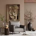 Cozy Gray Accent Chair with Throw Pillow Near Abstract Painting and Decorative Vase