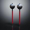 Two Black Spherical Top Red Pole Objects with Reflective Surface on Dark Background