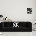 Black Multi Seater Sofa With Patterned Pillow Zebra Art And Robot Vacuum In Modern Room