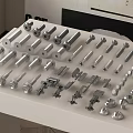 Assorted Hardware Tools With Bolts Nuts Screws And Metal Fasteners On White Table 3d model