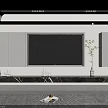 Modern Minimalist TV Background Wall With White Cabinets Black Marble Stand And Green Plant Decorations