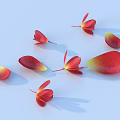 Red and yellow flower petals scattered on soft light blue background