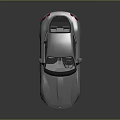 Sleek Silver Sports Car With Aerodynamic Design And Alloy Wheels