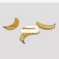 Three Ripe Yellow Bananas with Black Spots on Clean White Background