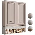 Light Colored Decorative Cabinet With Paneled Doors Brass Handles Open Lower Shelf And Decorative Spheres