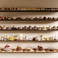 Various Desserts And Beverages Displayed On Multiple Wooden Shelves With Different Toppings And Decorations