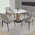 Modern Round Table With Four Light Gray Chairs And Green Plant In Indoor Setting
