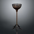 Vintage Metal Floor Candlestick With Intricate Hollow Top And Three Legged Base