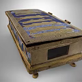 Antique Ornate Decorative Box Featuring Intricate Golden Figure Reliefs On Blue Background