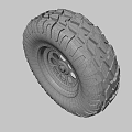 Off Road Vehicle Tire With Deep Tread Pattern And Silver Alloy Rim
