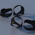 Black Clothing Ring Accessories Four Pieces On Light Blue Background 3d model