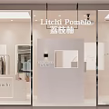 Stylish Clothing Store Window Display With Mannequin And Hanging Clothes On Racks