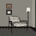Stylish Accent Chair With Metal Frame Patterned Cushion Floor Lamp Framed Art And Area Rug