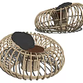 Woven Rattan Outdoor Chair With Modern Circular Design And Black Cushion
