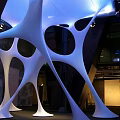 Modern White Illuminated Sculptural Art With Curved Hollow Design In Indoor Space