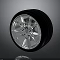 Car Wheel Rim and Tire Design Featuring Shiny Metal Details and Black Rubber