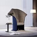 Modern Gray and Blue Accent Chair with Side Table Books Plant and Floor Lamp