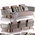 Modern Outdoor Sofa With Woven Armrests Metal Frame Brown Cushions And Throw Blanket