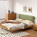 Wooden Double Bed with Green Headboard White Quilt Brown Blanket and Yellow Pillows