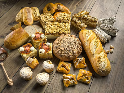 Assorted Freshly Baked Breads And Pastries On Wooden Table With Honey And Nuts 3d model